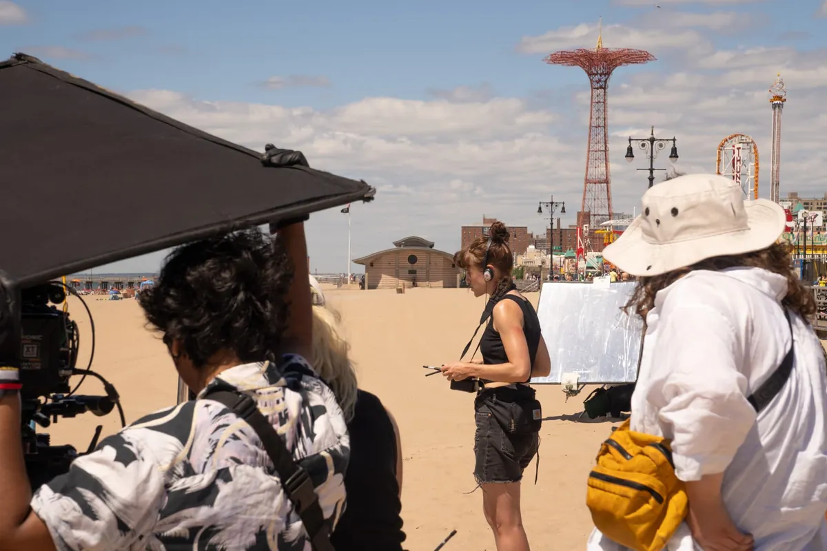 Kelly McCready directing on the beach at Coney Island during the shoot for Perfect Love
